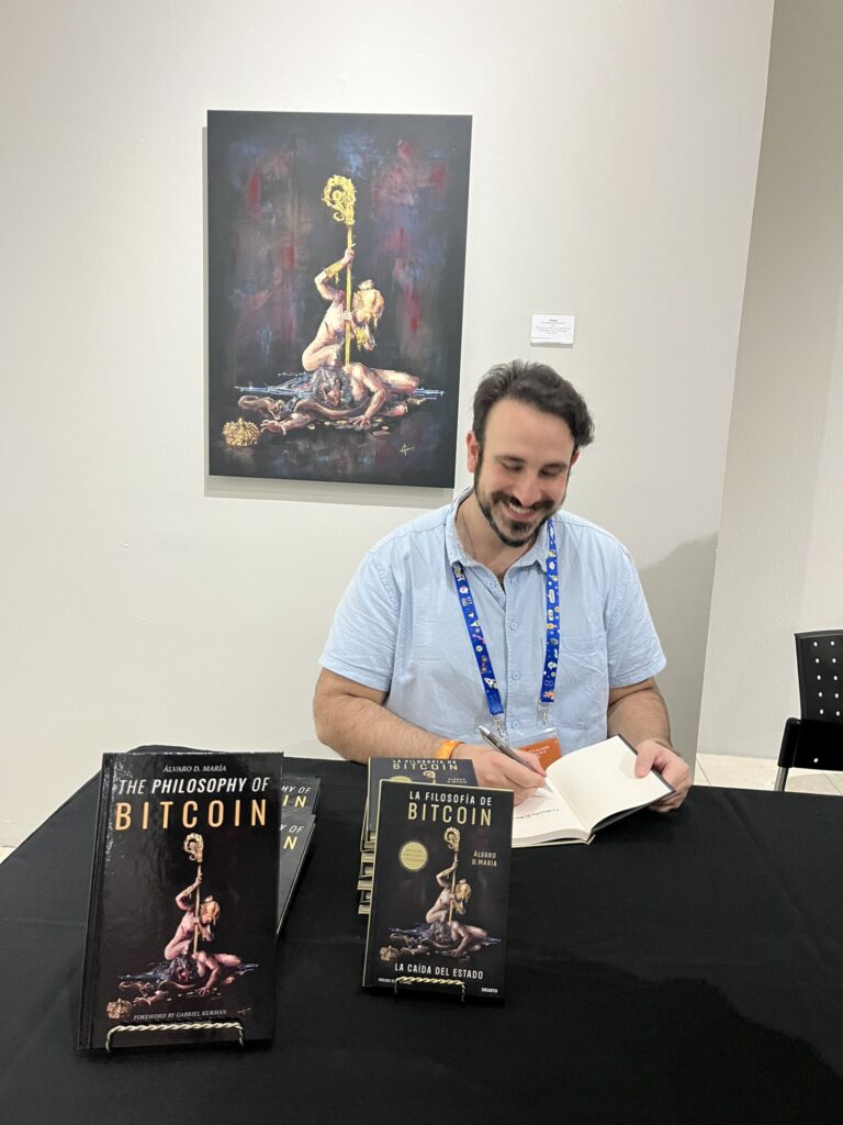Alvaro D María signing books.