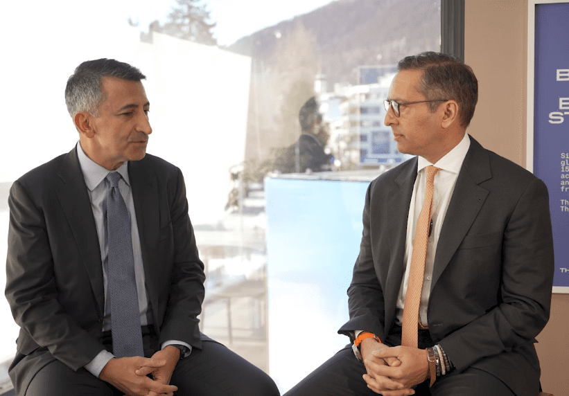 Coinbase executives Faryar Shirzad and Brett Tejpaul at Davos 2026.